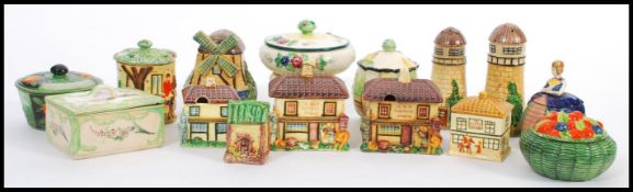 A collection of vintage early 20th century Japanese Marutomoware to include honey pots etc.