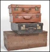 A stack of vintage suitcases to include 2 leather examples, a black vinyl case and  a wooden 19th