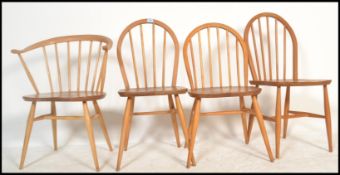 A vintage mid 20th Century Ercol 451 Cowhorn design, blonde beech and elm fireside armchair / dining