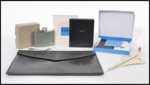A collection of Concorde memorabilia to include and attache case, menu, card, luggage labels, spirit