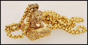 A gold plated pendant necklace having a pendant seal in the form of a lion with a spring ring clasp.