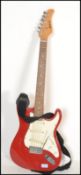 A vintage retro 20th century Shine electric guitar having a red body with white scratch guard.