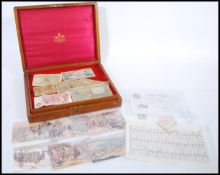 A collection of vintage banknotes contained within a Mappin and Webb cutlery box. Comprises of White