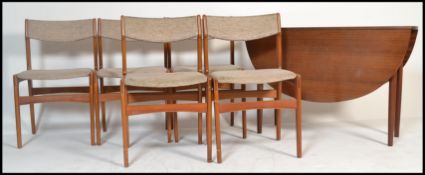 A 1970's Danish influence teak wood drop leaf dining table and chairs having the original wool
