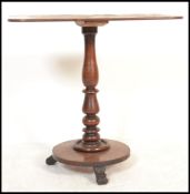 A 19th century Victorian mahogany side occasional table raised on a tripod base with turned column