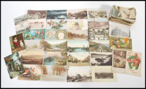 A selection of early 20th Century Edwardian vintage postcards with many examples showing