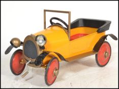 A original Brum Ragdoll made tin plate child's ride along pedal car in the form of the children's TV
