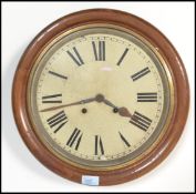 A mahogany cased station clock with Roman numeral markers, housing a twin train movement and chiming