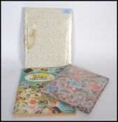 A collection of stamps dating from the 19th century comprised within three albums containing