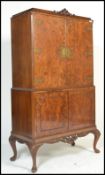 A vintage 20th century 1950's Art Deco style burr walnut tall cocktail cabinet raised on cabriole