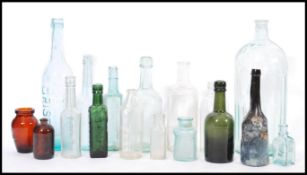 A collection of vintage early 20th century advertising bottles to include Pyrex, Carter and Co