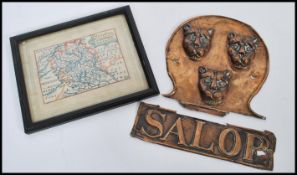 An early 20th Century embossed copper sign for Shropshire reading Salop with three lions above along