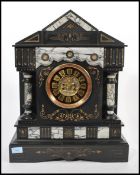 A 19th Century French slate mantel clock in the style of Japy Freres, in a black slate and limestone