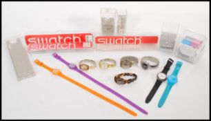 A collection of Swatch collectors watches, mens and ladies Swatch watches of various styles of