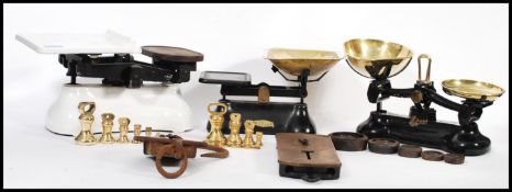 A collection of vintage 20th century shop / industrial weighing scales having cast metal bases. Most
