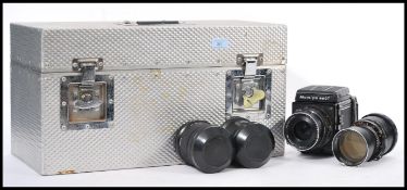A Mamiya RB 67 professional S camera in a metal flight case with a 250mm lens No.11196 and a 90mm