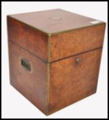 A 19th century George III burr walnut campaign tantalus - travelling decanter box. Brass bound