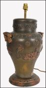 A 19th century large bronze twin handled vase lamp. Of Chinese influence being embellished with