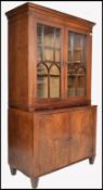 A Georgian 18th / 19th century flame mahogany library bookcase cabinet. Raised on shaped legs with