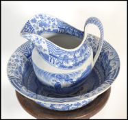 A 19th century George III mahogany washstand, circa 1800 complete with a blue and white Italianate