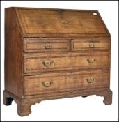 An 18th century North Country Lancashire bureau desk. Raised on bracket feet with a series of
