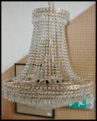 A 20th century large facet cut glass and brass electrolier chandelier.ÿ Having cut glass strings