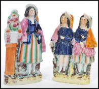 A pair of 19th century Victorianÿ Staffordshire flatback figurines. One depicting maiden next to