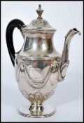 A late 18th / early 19th century silver hallmarked Georgian bachelors coffee pot raised on a