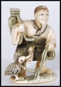A Japanese Meiji Period ivory netsuke carved as a fisherman with basket over his shoulder and