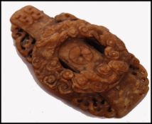 A Ming Dynasty 16th Century or older mutton fat jade panel having a central dragon roundel with