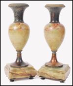 A pair of 19th century Victorian bronze and onyx garniture vases. Raised on bun feet with square