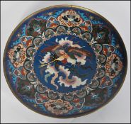 A 19th century Japanese Meijiÿ period (1868-1912) Japanese cloisonne enamel charger. Of roundel