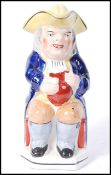 An early 19th century, circa 1840 toby jug / character jug of Sir Toby Belch from Shakespeare's