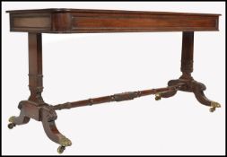 A Regency 19th century mahogany library table / desk in the manner of Gillows of Lancaster. Raised