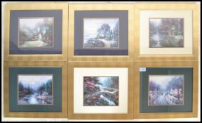 A set of six vintage Thomas Kinkade prints being set to gilt frames. Each depicting a busy scenes