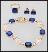 A fantastic 14ct gold Hong Kong Demi-Parure bracelet, earrings and ring set having blue faceted