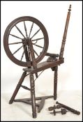 A believed 19th century Victoria North County Spinning Wheel having turned legs bobbin style base