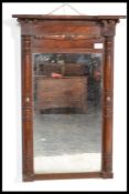 A late Victorian mahogany pier mirror, having decorative turned columns flanking the rectangular