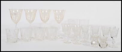 A collection of Edinburgh cut glass crystal glasses, together with a set of four wine glasses