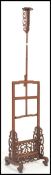A vintage 20th century Chinese hardwood adjustable floor standing candlestick / lamp base having