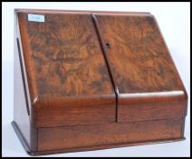 An early 20th century Edwardian oak desk calendar and stationery tidy compendium having fully