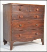 A Georgian 19th century mahogany chest of drawers having knob handles with a two short over three