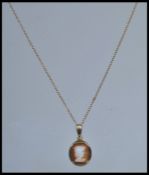A 20th century 9ct gold hallmarked ladies cameo pendant and necklace chain, weight 2.0g  length of