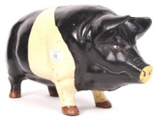 20TH CENTURY CAST IRON SADDLEBACK PIG MONEY BANK