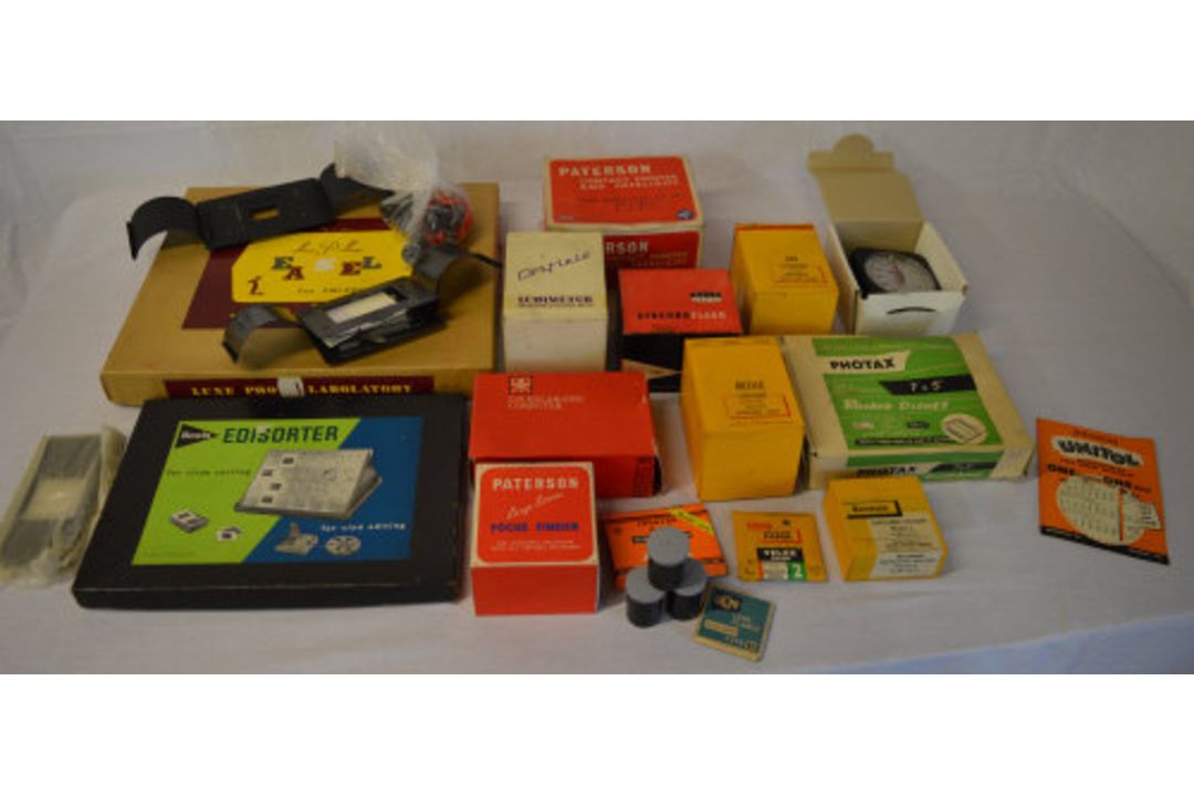 Photography accessories including enlarging meters, safelights, rocker dishes, focus finder,