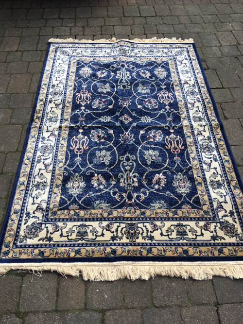 Blue ground cashmere rug with all over zieglar design 200cm by 130cm