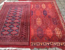 2 red ground Persian style rugs.