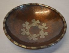 Arts & Crafts copper and pewter banded bowl with central clover motif,
