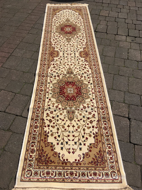 Ivory ground cashmere runner with medallion design 310cm by 78cm