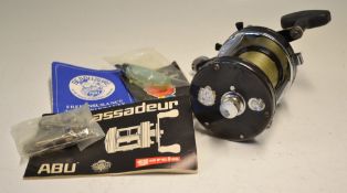 Abu Ambassadeur 7000C black multiplier reel, 3 screw smooth black end plate, star drag with level